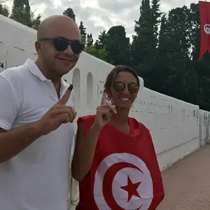 Tunisian voters display inked fingers indicating they've voted in the September 15, 2019, presidential election.