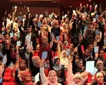 NDI Debate-Audience hold up cards to vote for the debate team from Yarmouk University, winner of Jordan&#039;s first-ever national student debate competition_Debating on allowing parties to operate in universities.JPG