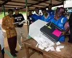 Sierra Leone domestic monitors watch vote count during 2007 elections.