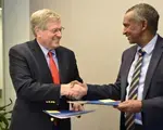 NDI President Kenneth Wollack and IGAD Executive Secretary Amb. Mahboub Maalim shake hands following the signing of an MoU.