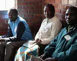 Party agents in a polling station in Harare, with their observation materials, notebooks and identifying accreditation, watch on as citizens vote the July 30th elections in Zimbabwe.